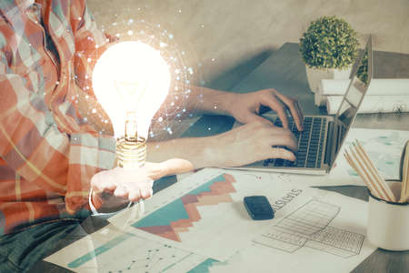 Growing arrows with businessman working on computer on background. Success concept. Double exposure.の写真素材