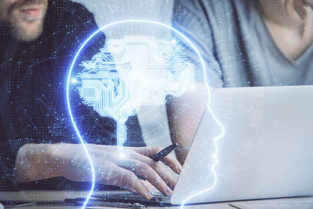 Businessman with computer background with brain theme hologram. Concept of brainstorm. Multi...