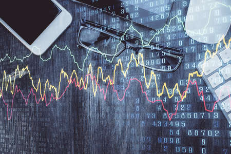 Multi exposure of forex graph hologram over desktop with phone. Top view. Mobile trade platform...
