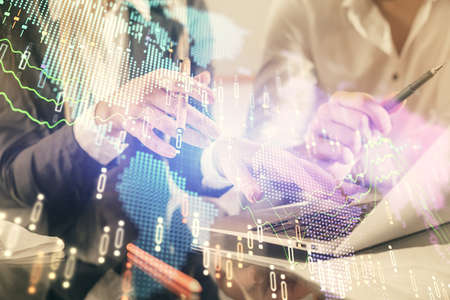 Double exposure of man and woman working together and forex chart hologram. Business concept....