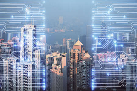 Double exposure of technology theme hologram and cityscape background. Concept of Hightech.