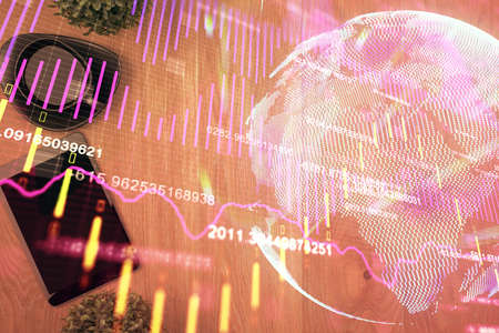 Multi exposure of financial chart hologram over desktop with phone. Top view. Mobile trade platform...