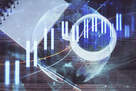 Double exposure of forex graph drawing and work table top veiw. Concept of financial analysis.