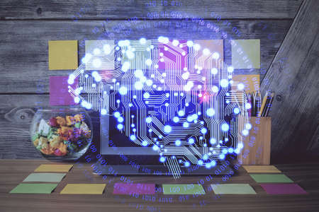 Double exposure of desktop computer and human brain drawing hologram. Ai concept.