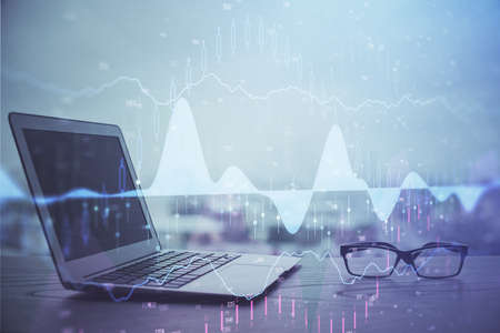 Forex Chart hologram on table with computer background. Double exposure. Concept of financial...