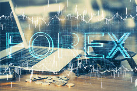 Multi exposure of chart and financial info and work space with computer background. Concept of international online trading.の写真素材