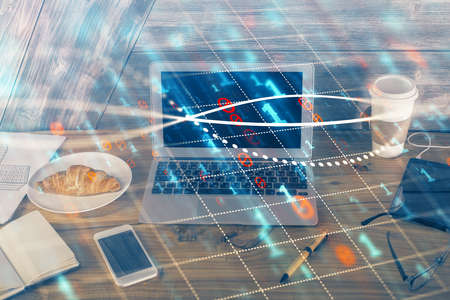 Multi exposure of graph and financial info and work space with computer background. Concept of...