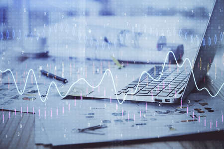 Forex market graph hologram and personal computer on background. Double exposure. Concept of...