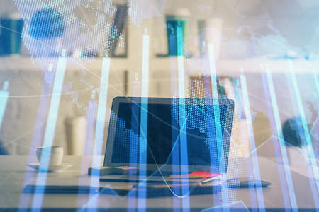 Forex market chart hologram and personal computer background. Multi exposure. Concept of investment.