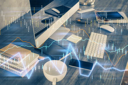 Double exposure of forex graph and work space with computer. Concept of international online...