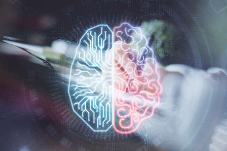 Multi exposure of writing hand on background with brain hologram. Concept of self learning.の写真素材