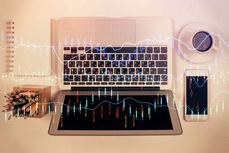 Stock market chart and top view computer on the table background. Multi exposure. Concept of...