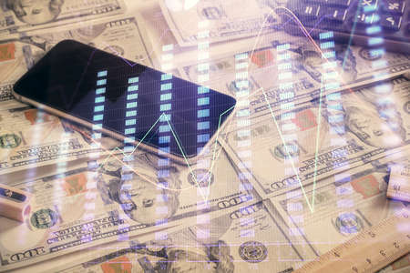 Double exposure of forex graph drawing over us dollars bill background. Concept of financial...