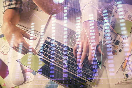 Double exposure of man and woman working together and forex graph hologram drawing. Financial...
