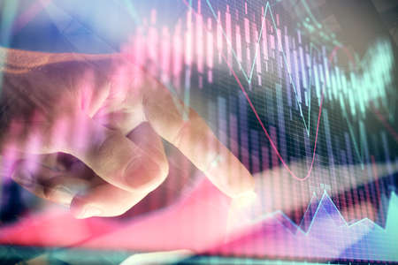Multi exposure of mans hands holding and using a phone and financial chart drawing. Market analysis...