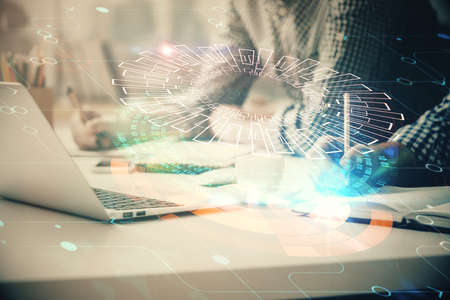 Businessman with computer background with technology theme hologram. Concept of hightech. Multi...