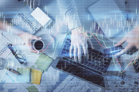 Double exposure of man and woman working together and forex graph hologram drawing. Financial...