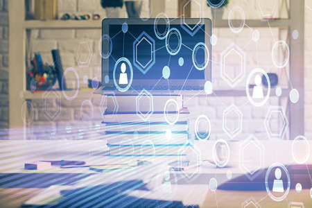 Computer on desktop with social network hologram. Multi exposure. Concept of international people...
