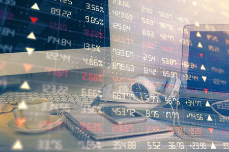 Financial chart drawing and table with computer on background. Double exposure. Concept of...