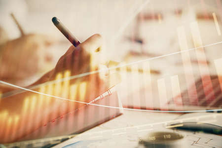 Double exposure of forex chart drawing over people taking notes background. Concept of financial...