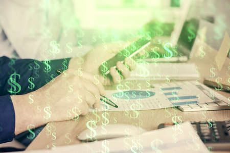 Double exposure of mans hands holding and using a digital device and forex graph drawing. Financial...