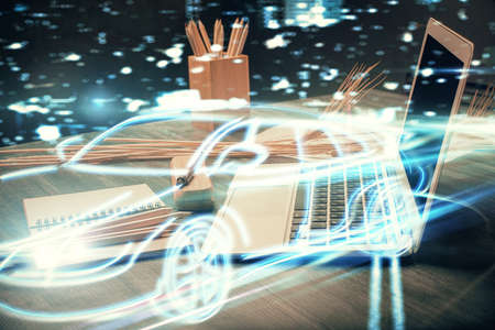 Desktop computer background in office with automobile hologram drawing. Multi exposure. Tech concept.の写真素材