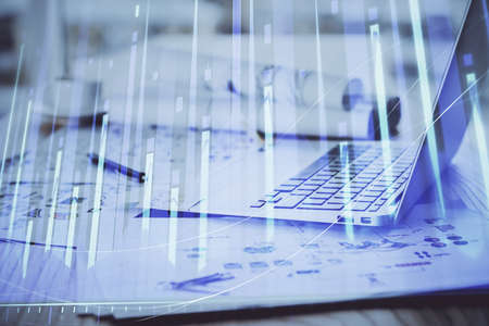 Forex Chart hologram on table with computer background. Double exposure. Concept of financial...