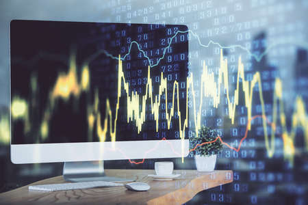 Stock market chart hologram drawn on personal computer background. Multi exposure. Concept of...