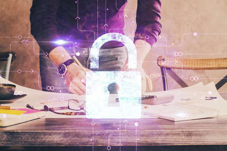 Humans hands with cyber security theme multi exposure background drawings. Concept of online...
