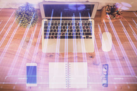 Multi exposure of financial chart drawing over table background with computer. Concept of research....