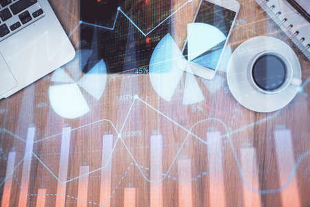 Multi exposure of forex graph hologram over desktop with phone. Top view. Mobile trade platform concept.の写真素材