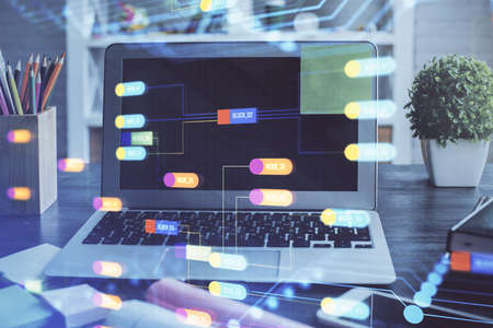 Double exposure of desktop with personal computer on background and tech theme drawing. Concept of...