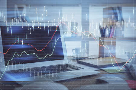 Financial graph colorful drawing and table with computer on background. Double exposure. Concept of...