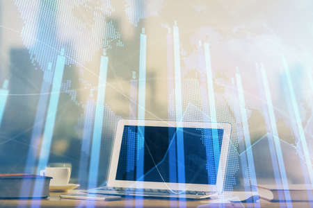 Forex Chart hologram on table with computer background. Multi exposure. Concept of financial...
