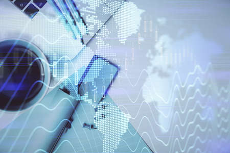 Double exposure of forex graph drawing over desktop background with computer. Concept of financial...