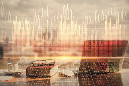 Double exposure of financial chart drawings and desk with open notebook background. Concept of forex...