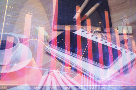 Double exposure of forex chart drawing and cell phone background. Concept of financial tradingの写真素材