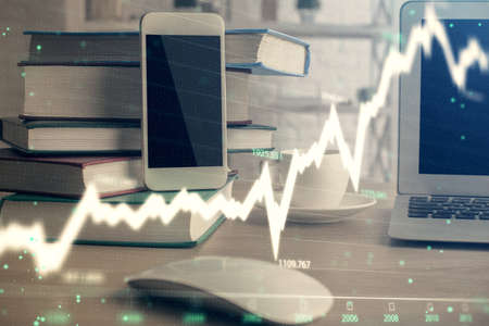Double exposure of financial graph drawing and cell phone background. Concept of forex tradingの写真素材