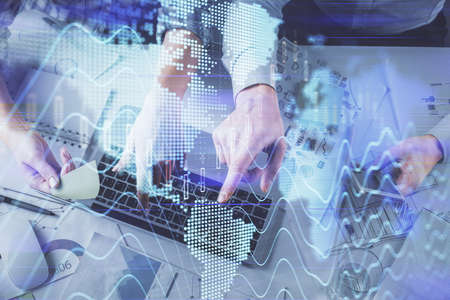 Double exposure of man and woman working together and forex graph hologram drawing. Financial...