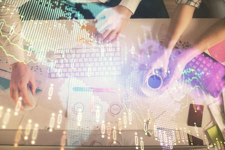 Double exposure of man and woman working together and financial chart hologram drawing. market...