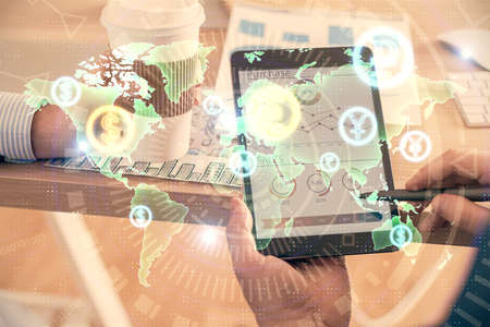 Double exposure of mans hands holding and using a phone and financial chart drawing. Market analysis...
