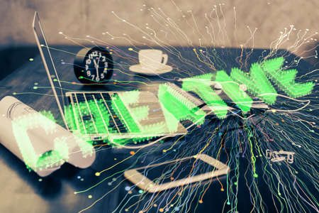 Desktop computer background in office and start up theme hologram drawing. Double exposure. Startup...