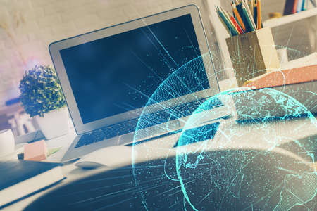 Computer on desktop with social network hologram. Multi exposure. Concept of international people connections.の写真素材