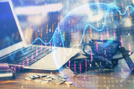 Double exposure of forex graph and work space with computer. Concept of international online...