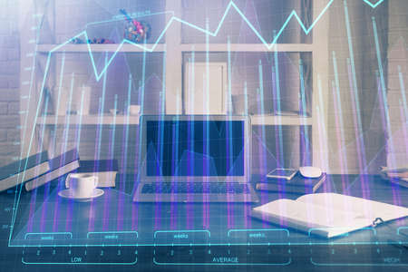 Financial market graph hologram and personal computer on background. Double exposure. Concept of...