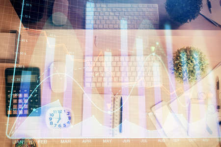 Multi exposure of forex graph drawing over desktop background with computer. Concept of financial...