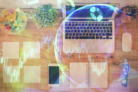 Stock market graph and top view computer on the table background. Multi exposure. Concept of...