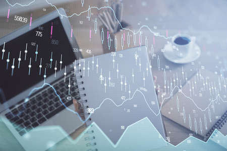 Double exposure of businesswoman hands typing on computer and forex chart hologram drawing....
