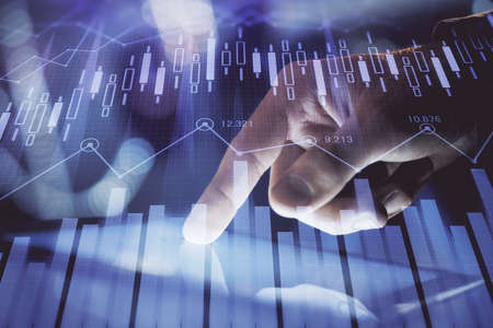 Multi exposure of mans hands holding and using a phone and financial chart drawing. Market analysis...