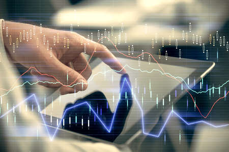 Multi exposure of mans hands holding and using a phone and financial chart drawing. Market analysis...